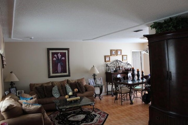 living room featuring a textured ceiling