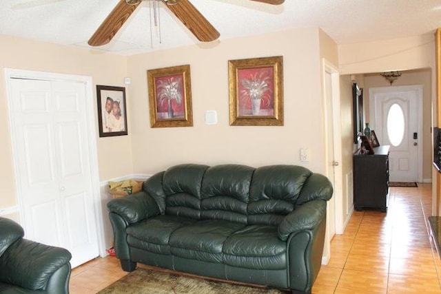 tiled living room with a textured ceiling