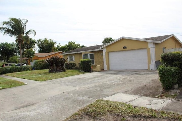 single story home with a front lawn and a garage