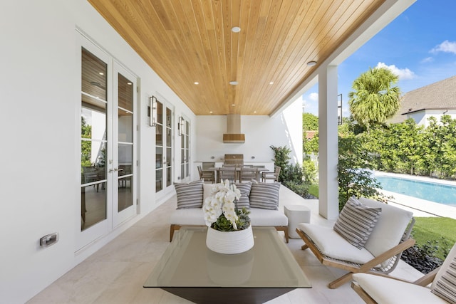 view of patio featuring area for grilling, outdoor lounge area, and french doors