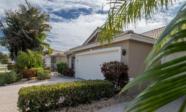 view of side of home with a garage