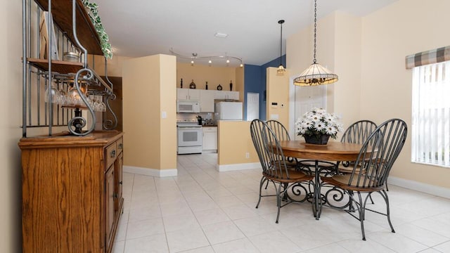 dining area with light tile patterned flooring