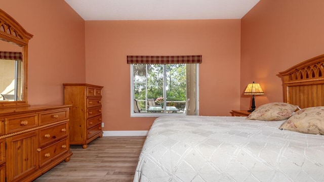 bedroom with light hardwood / wood-style flooring