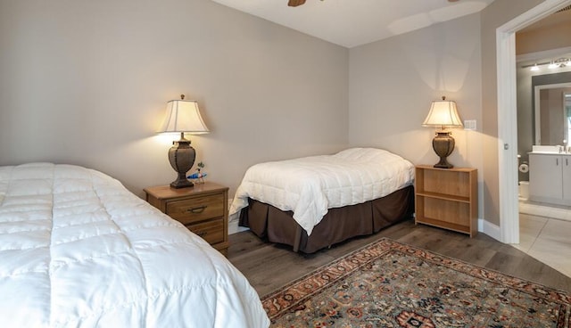 bedroom with ceiling fan, hardwood / wood-style flooring, and ensuite bathroom