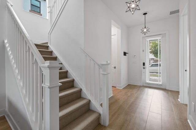 foyer entrance with light wood-type flooring