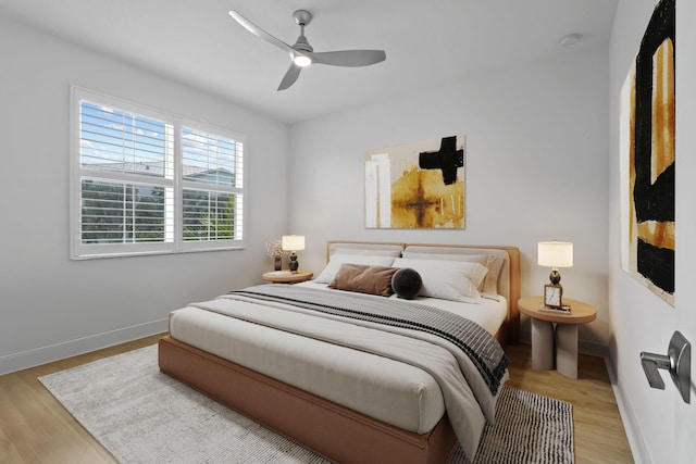 bedroom featuring ceiling fan and light hardwood / wood-style flooring