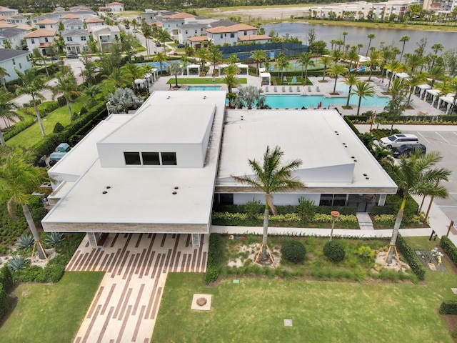 birds eye view of property with a water view