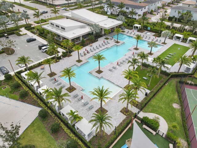 view of pool with a patio and a water view