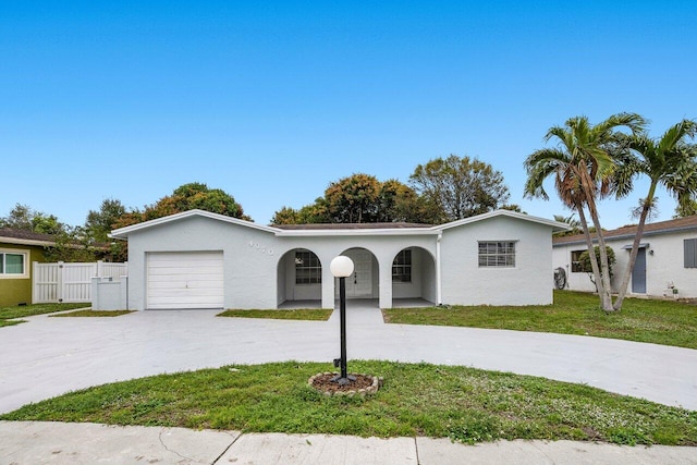 view of front facade featuring a garage and a front yard