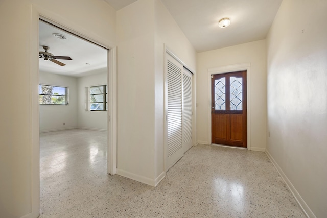 foyer with ceiling fan