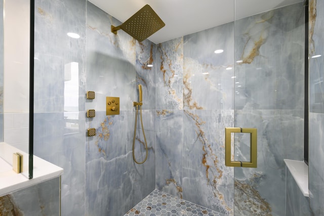 bathroom with a tile shower