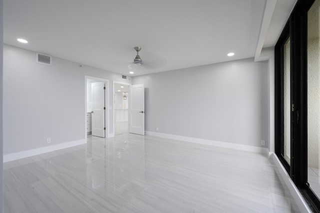 unfurnished bedroom featuring ceiling fan and ensuite bath