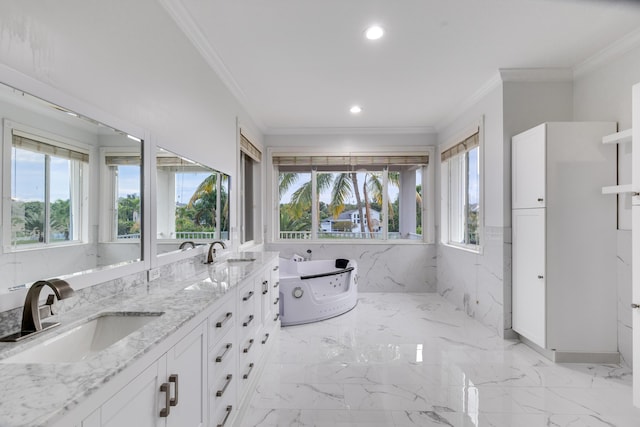 bathroom with a tub to relax in, vanity, and crown molding