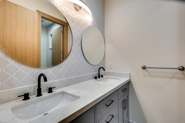 bathroom featuring tasteful backsplash and vanity