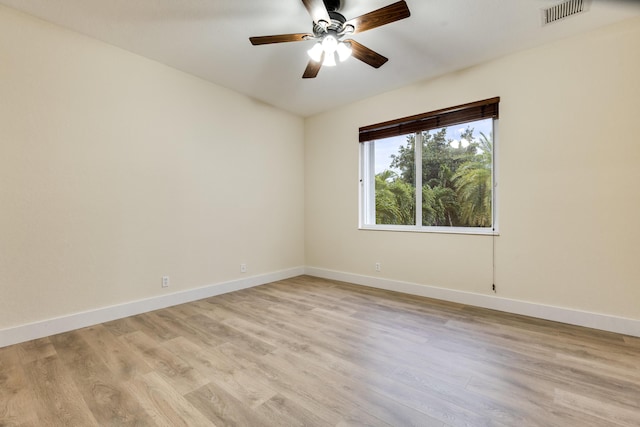 spare room with ceiling fan and light hardwood / wood-style floors