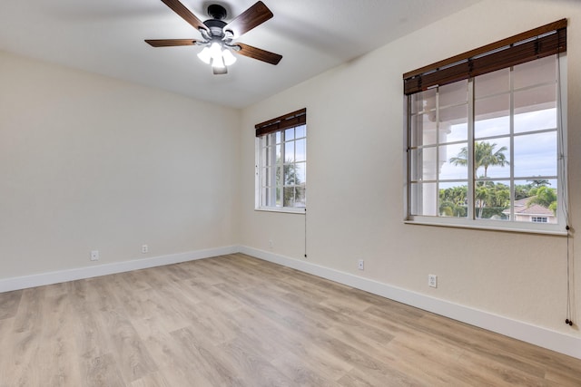 spare room featuring ceiling fan and light hardwood / wood-style flooring