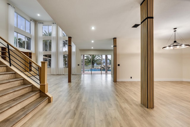 interior space with hardwood / wood-style flooring and a notable chandelier