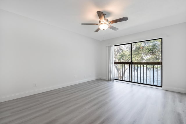 spare room featuring ceiling fan and hardwood / wood-style floors