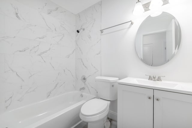 full bathroom featuring tiled shower / bath, vanity, and toilet