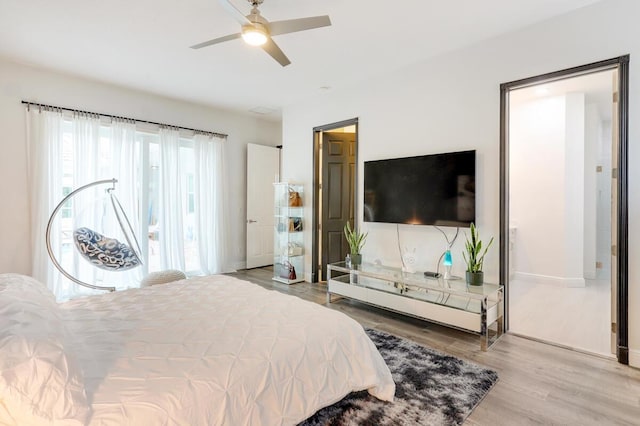 bedroom with hardwood / wood-style floors and ceiling fan