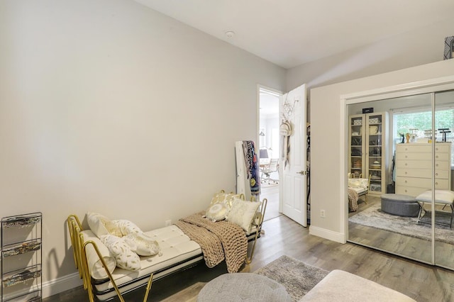 living area with hardwood / wood-style flooring