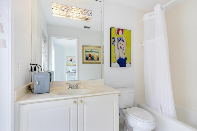 full bathroom featuring toilet, vanity, and shower / bath combo