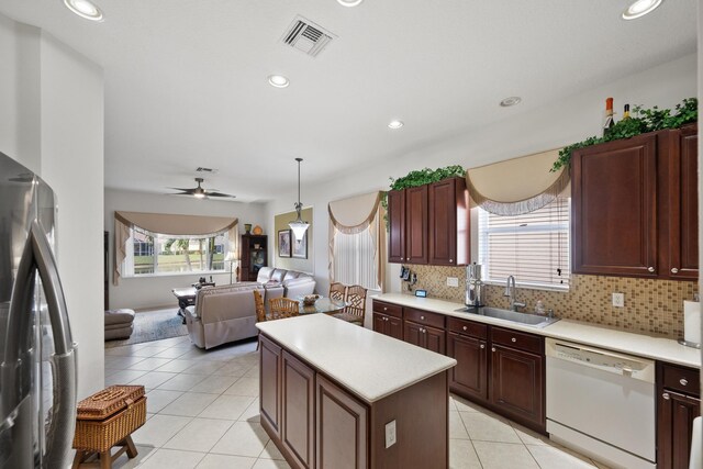 tiled dining space featuring an inviting chandelier