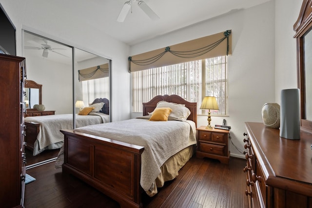 bedroom with ceiling fan, dark hardwood / wood-style flooring, and a closet