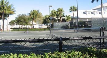 surrounding community with tennis court