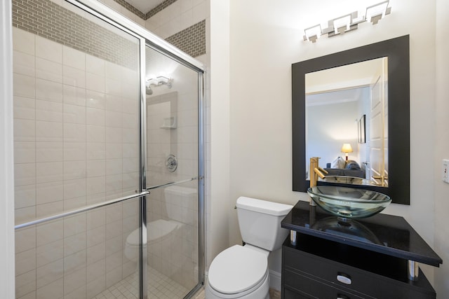 bathroom with vanity, toilet, and walk in shower