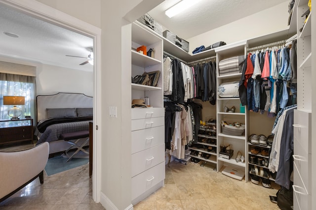 spacious closet featuring ceiling fan