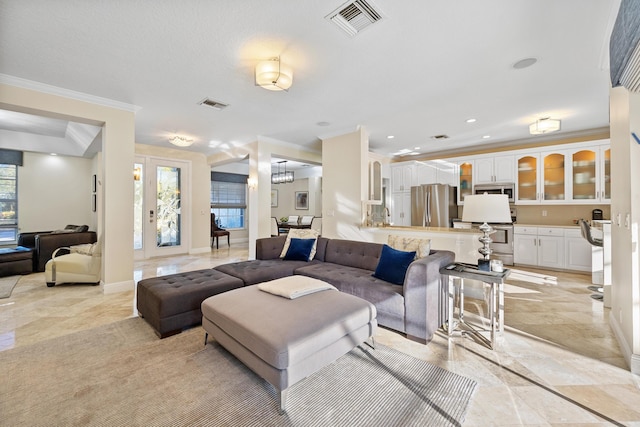 living room featuring crown molding