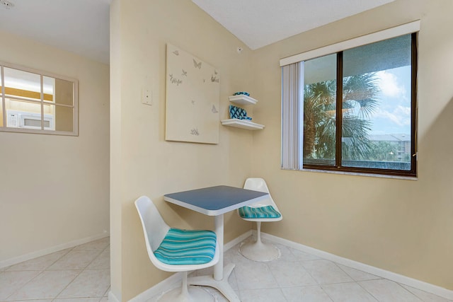 interior space featuring light tile patterned floors and a healthy amount of sunlight