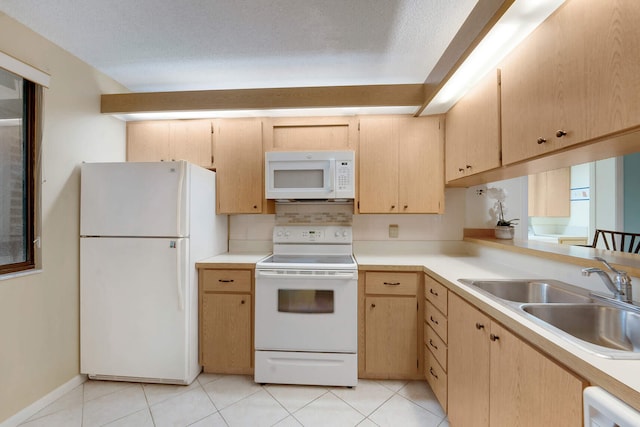 kitchen with sink, light brown cabinets, white appliances, and light tile patterned floors