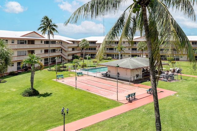 view of property's community with a lawn