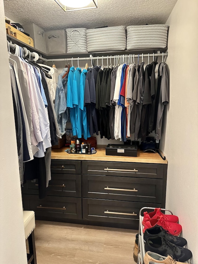 walk in closet featuring light wood-type flooring