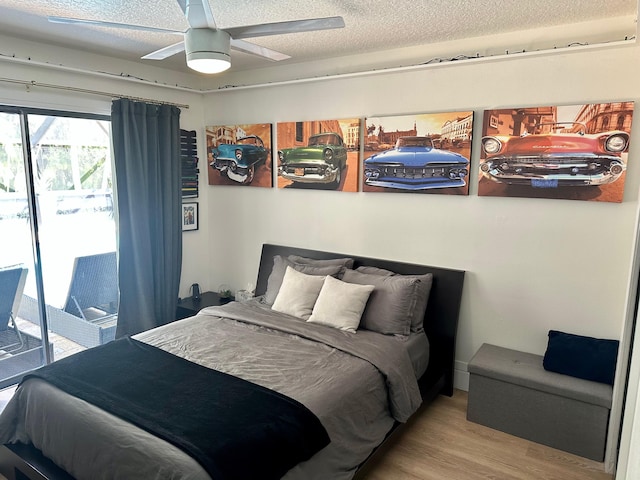 bedroom with ceiling fan, light hardwood / wood-style floors, a textured ceiling, and access to exterior