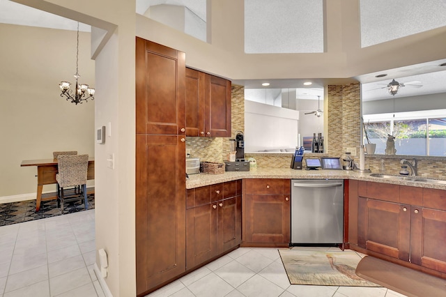 kitchen with sink, tasteful backsplash, stainless steel dishwasher, ceiling fan, and a high ceiling