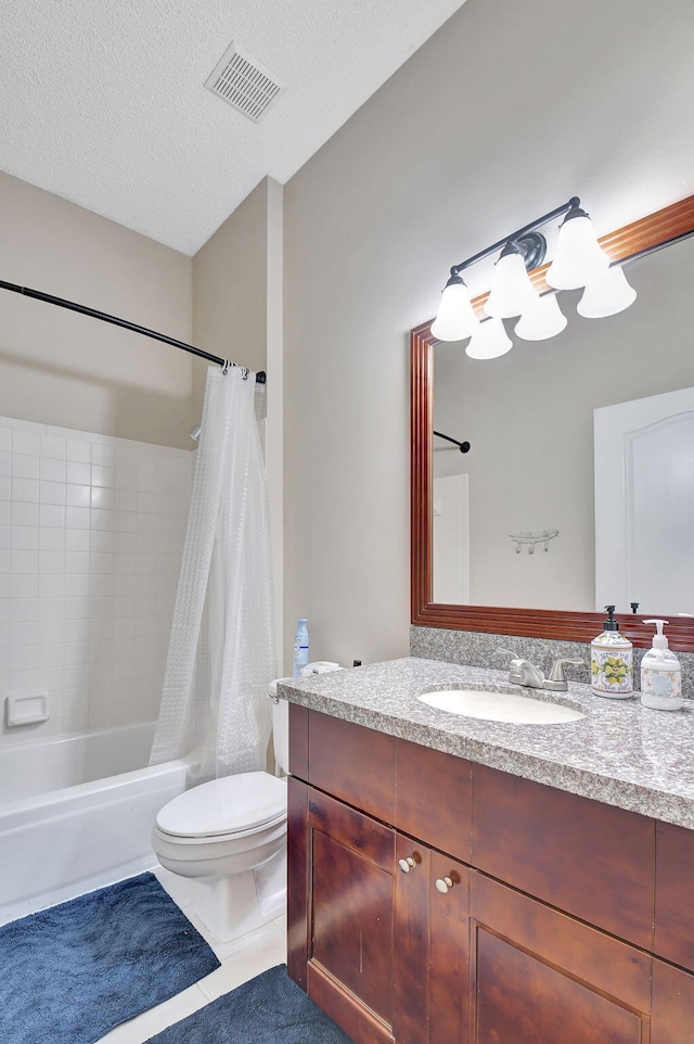 full bathroom with tile patterned floors, toilet, a textured ceiling, vanity, and shower / bath combination with curtain