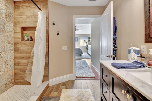 bathroom with vanity, hardwood / wood-style flooring, and a shower with shower curtain