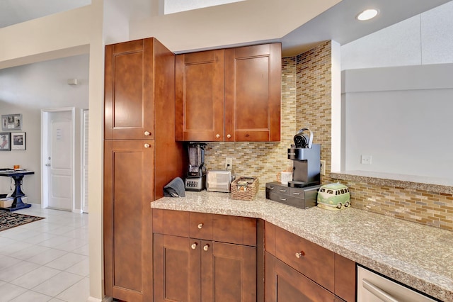 kitchen featuring tasteful backsplash and light tile patterned floors