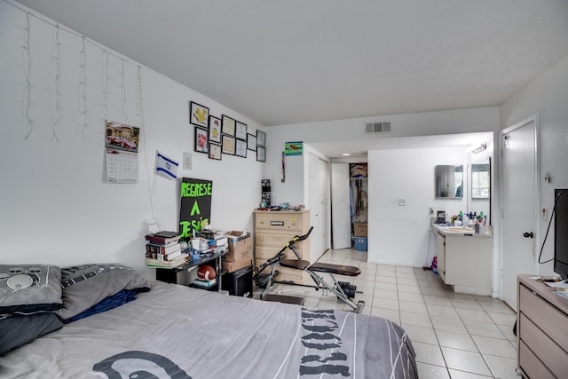 bedroom with light tile patterned floors