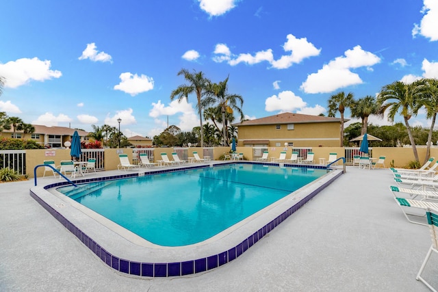 view of swimming pool with a patio