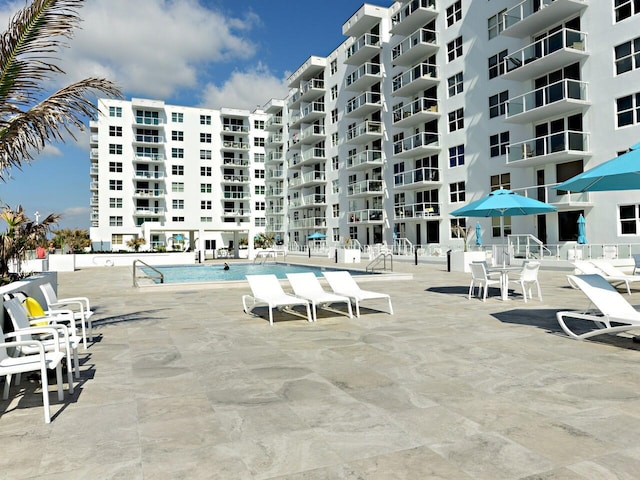 view of swimming pool featuring a patio