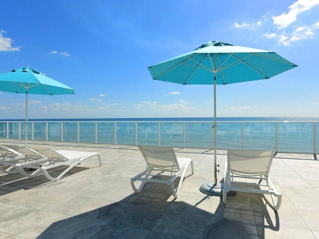 view of patio featuring a water view