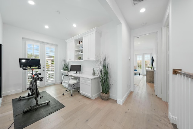 office with light wood-type flooring