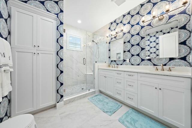 bathroom featuring an enclosed shower and vanity