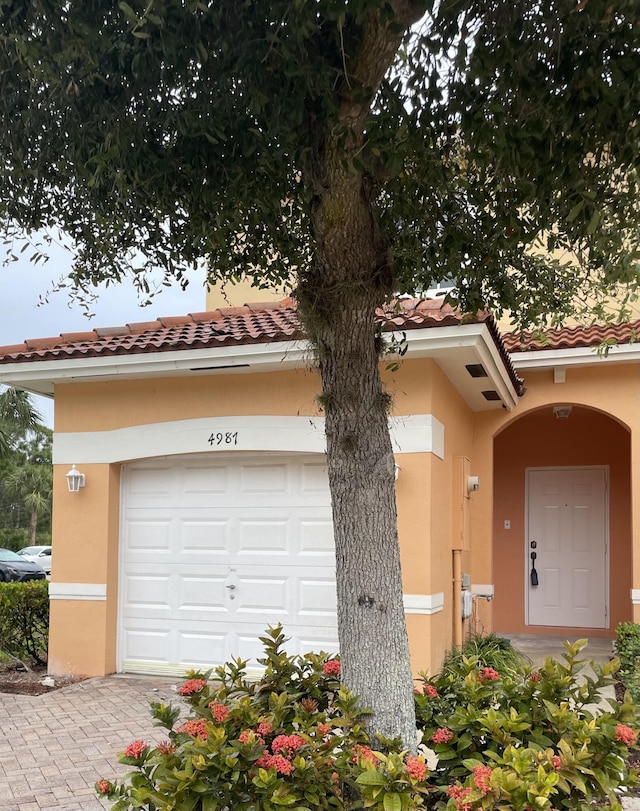 mediterranean / spanish-style house featuring a garage