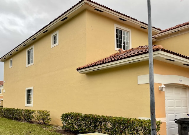 view of property exterior featuring a garage