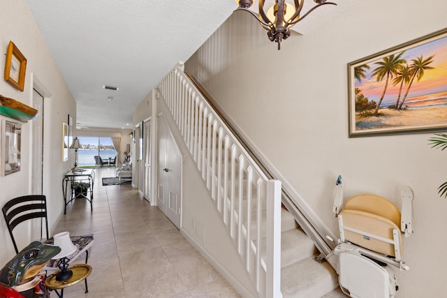 staircase with tile patterned flooring